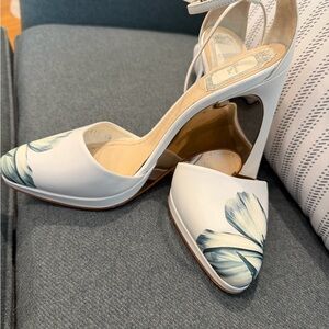 Christian Dior white leather wedge heel with blue floral accents.